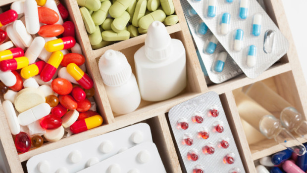 medical pills and ampules in wooden box